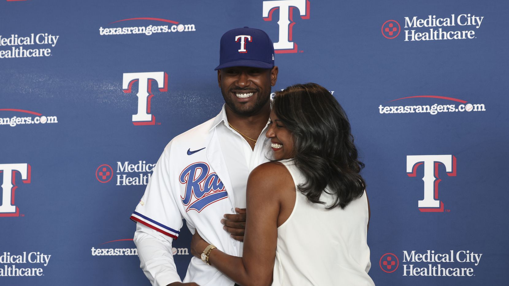 Kumar Rocker, first-round draft pick, gets hugged by his mother, Lalitha Rocker after the...