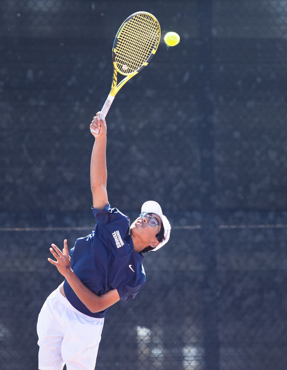 Frisco Centennial’s Akshay Kommineni serves the ball during a mixed doubles match with...