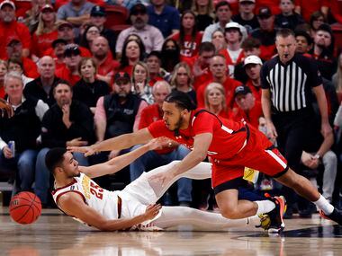 Texas Tech Red Raiders forward Kevin Obanor (0) dives for a loose ball over Iowa State...