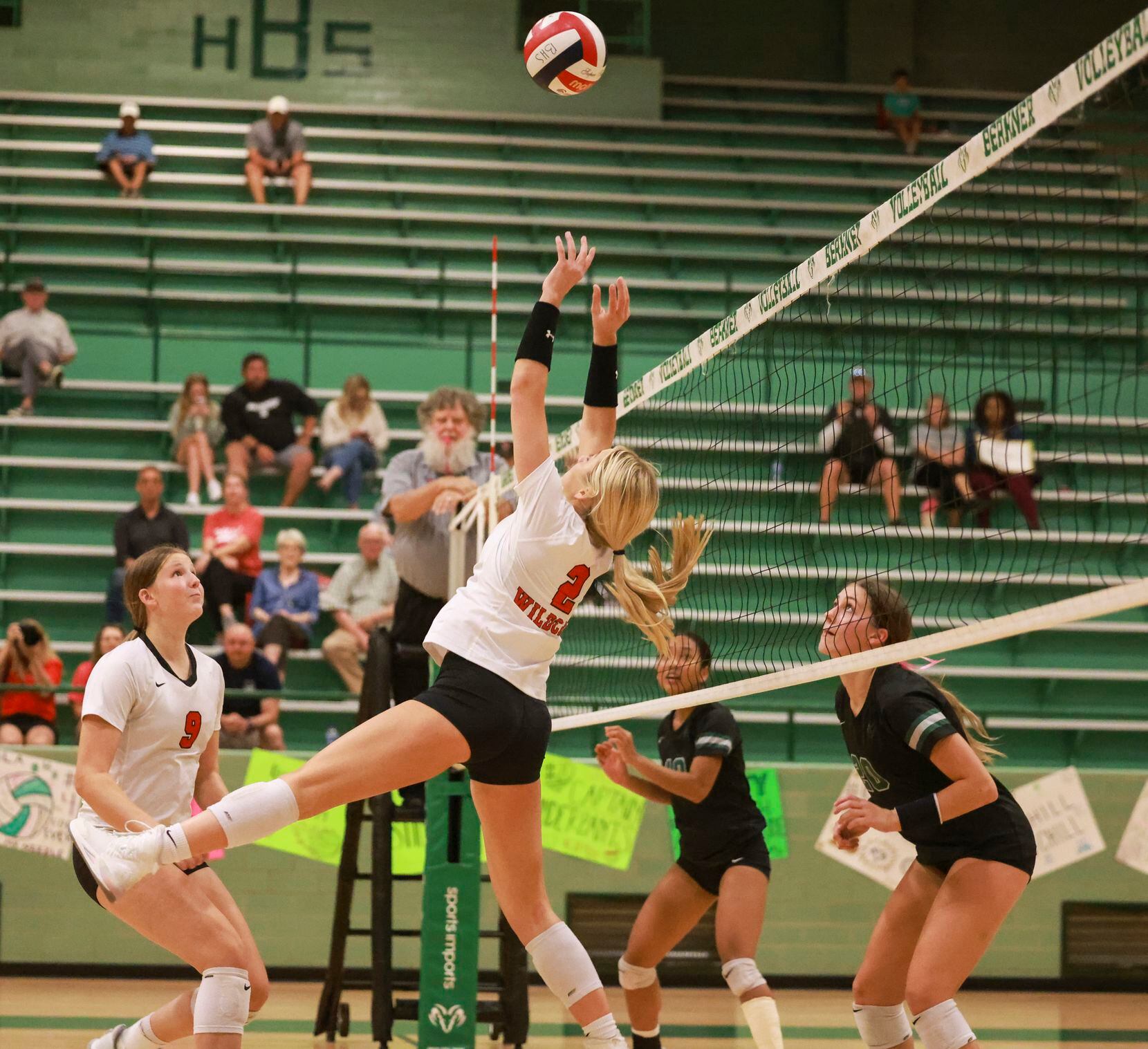 Lake Highlands High School Miller McDonald (2) sets the ball during the volleyball game...