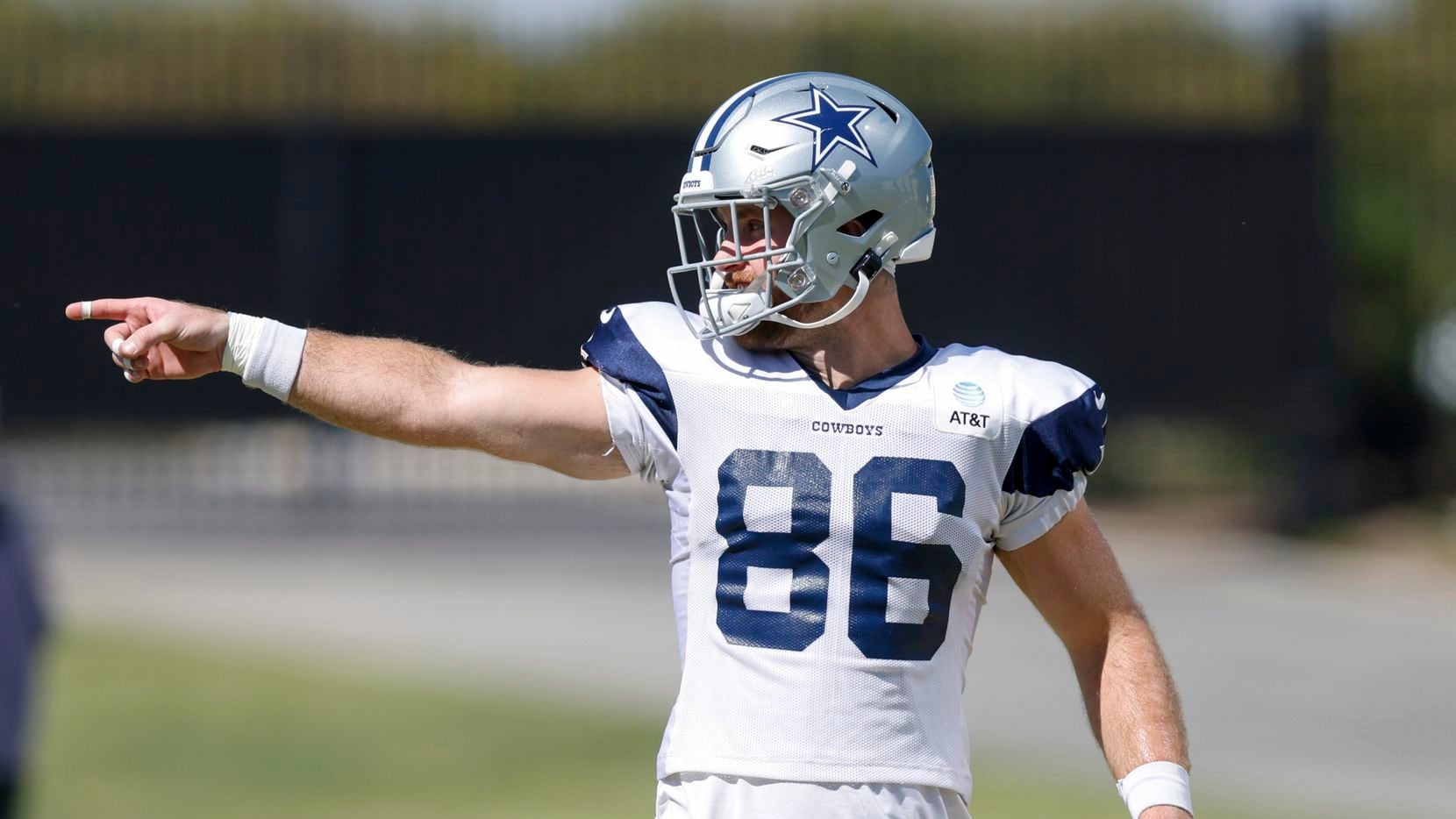 Dallas Cowboys tight end Dalton Schultz (86) points to a teammate during a practice at The...