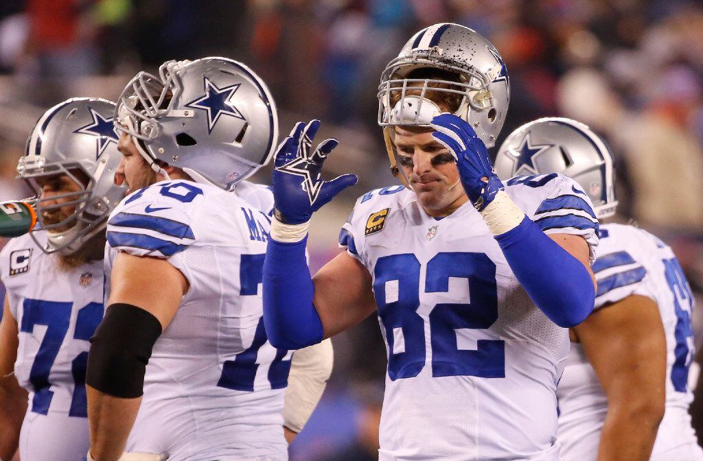 FILE - Cowboys tight end Jason Witten (82) puts his helmet on during a timeout in the fourth...