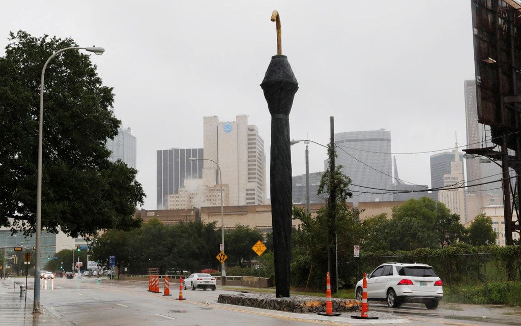 Dallas could have used the Lorenzo Hotel's giant 42-foot-high umbrella sculpture that pierces the median across from the hotel, in the 1000 block of South Akard Street near the Interstate 30 bridge , as rain fell most of the day on Monday, Oct. 15, 2018 