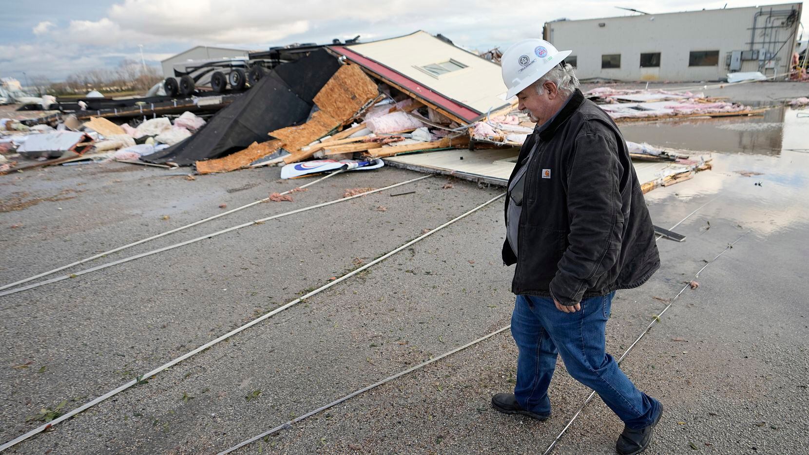 Johnny Graham walks past his storm-damaged office on Tuesday, Jan. 24, 2023, in Pasadena,...