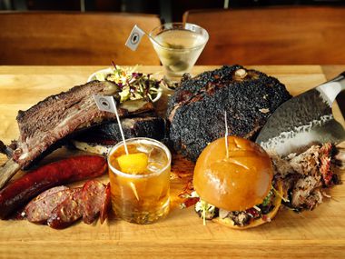 Oak'd opened Nov. 6, 2020. The menu includes beef ribs, jalapeño cheddar sausage, A Sandwich and Some Lovin' (named for celebrity radio host Kellie Rasberry's podcast), and chopped pork butt. Also pictured are two signature cocktails named for the radio host and her husband Allen Evans.