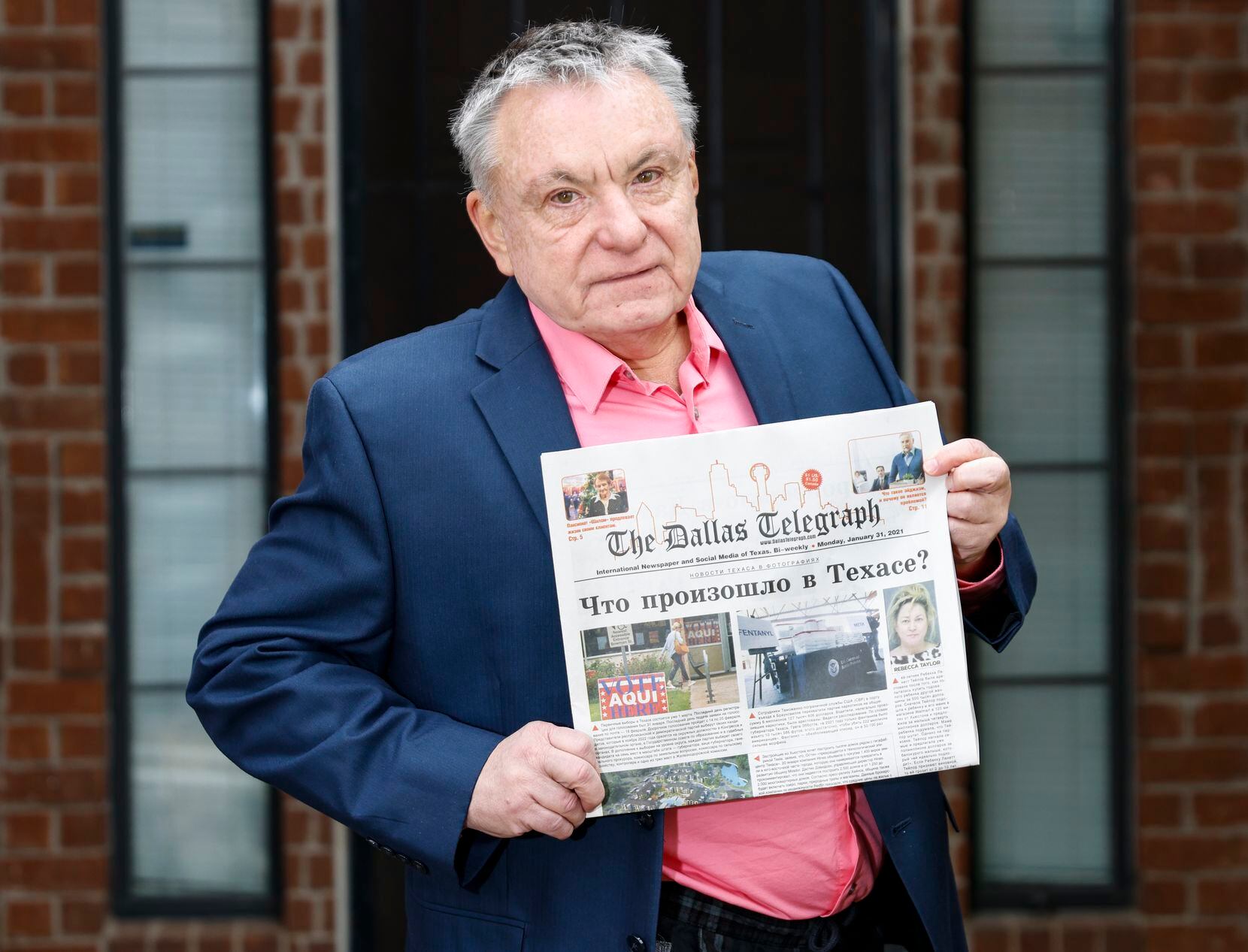 President and Publisher of The Dallas Telegraph, Serge Taran, holds the paper in his hands...