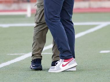 Coach Rhett Lashlee hugs Los Angeles Rams running back and former SMU player Xavier Jones...