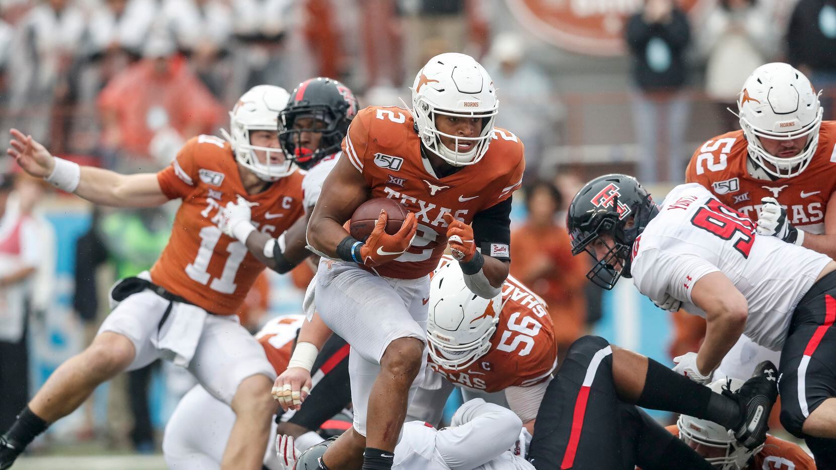 Roschon Johnson #2 of the Texas Longhorns rushes for a touchdown in the fourth quarter...