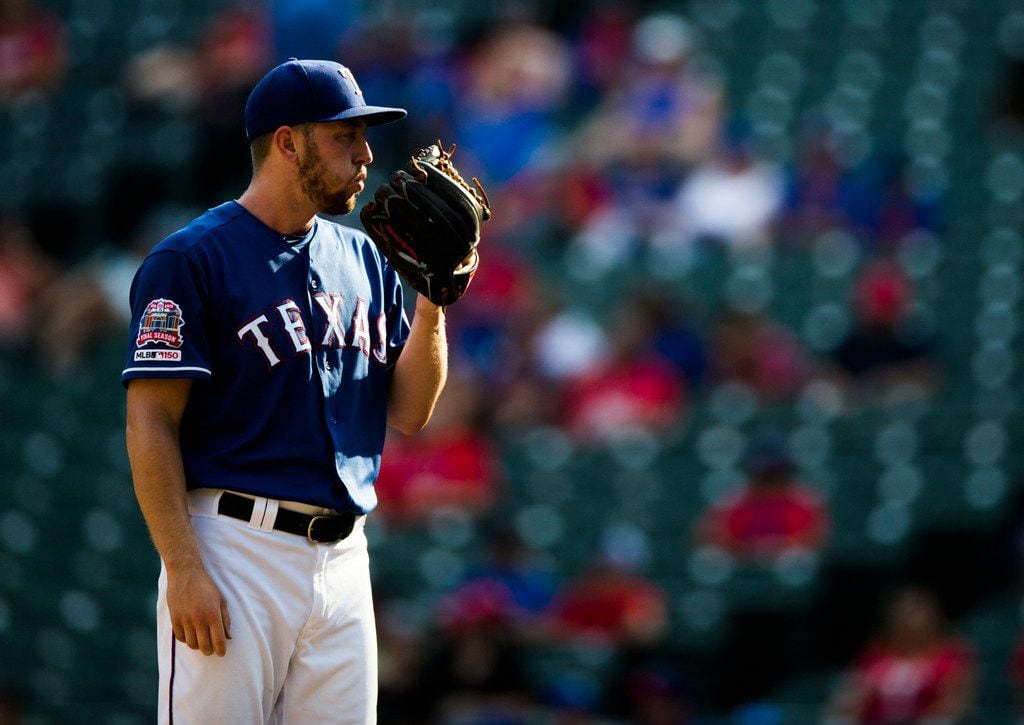 Texas Rangers relief pitcher Adrian Sampson (52) pitches during the ninth inning of an MLB...