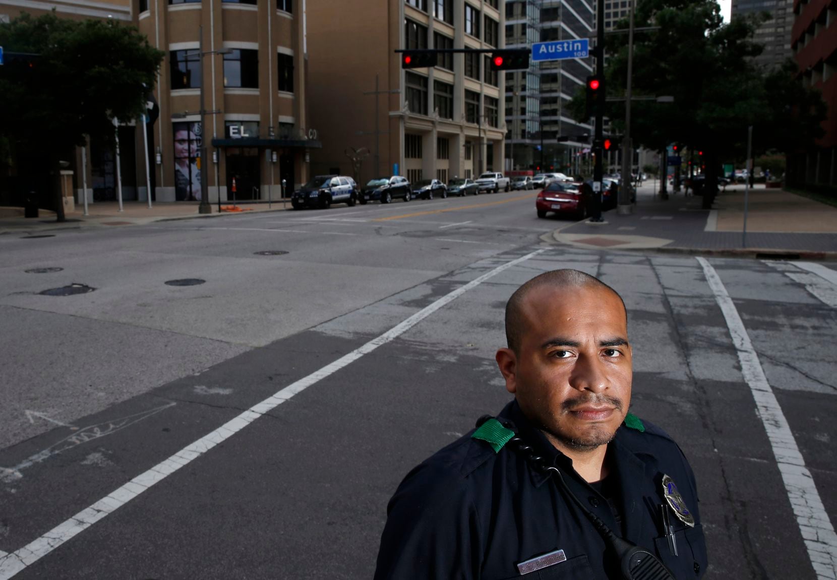 Dallas Police officer Jorge Barrientos poses for a portrait near El Centro College in...