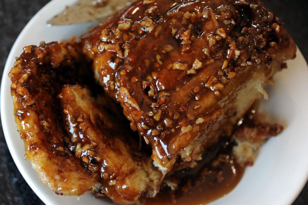 The famous cinnamon sticky buns are topped with pecans at Crossroads Diner in Dallas, TX on...