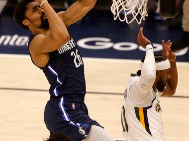 Dallas Mavericks guard Spencer Dinwiddie (26) attempts a shot in front of Utah Jazz guard...