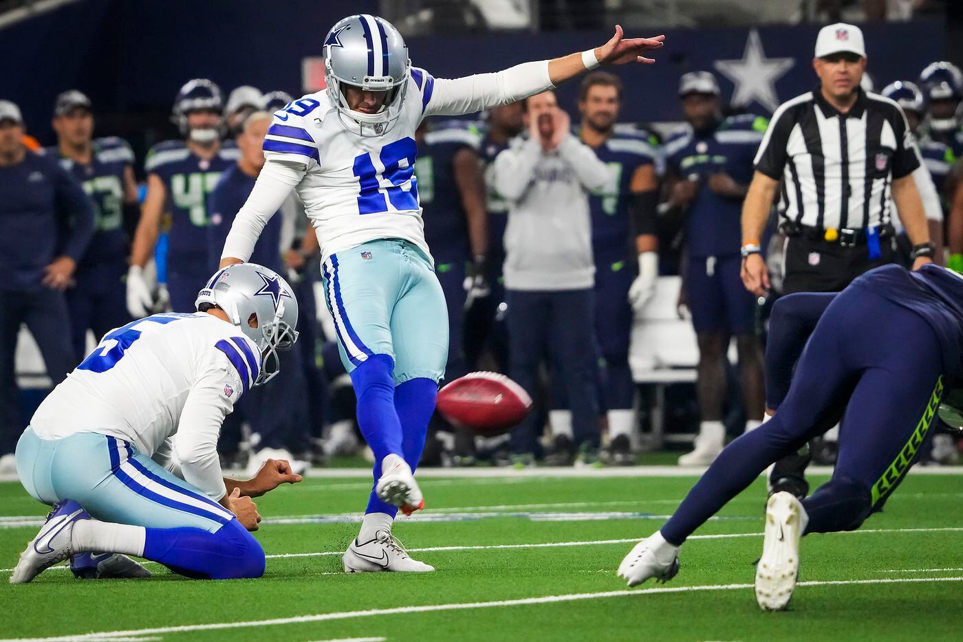 Dallas Cowboys place kicker Brett Maher (19) converts a point after try from the hold of...