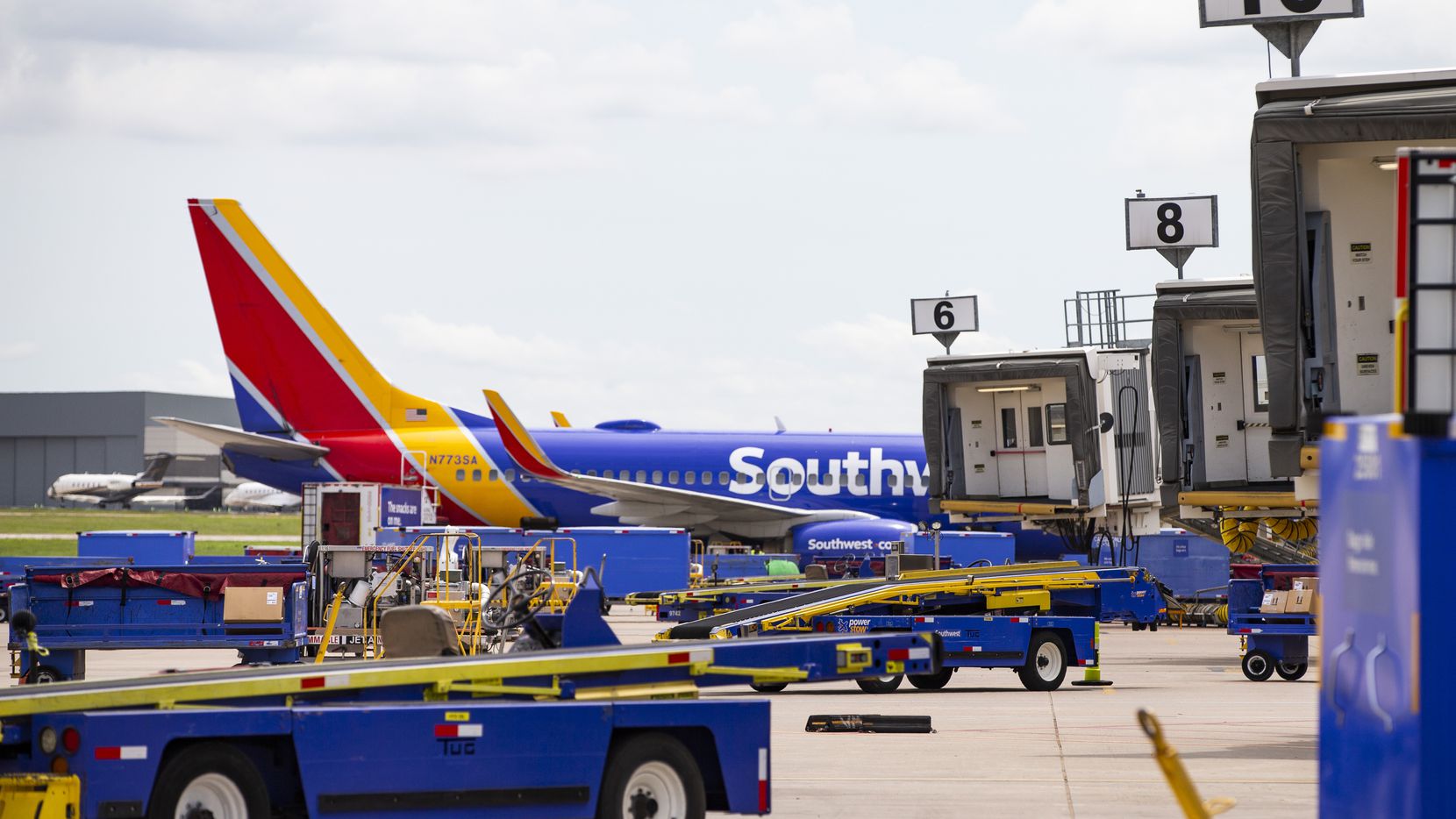 A Southwest Airlines 737 is parked at a gate at Dallas Love Field in Dallas, Wednesday, May 19, 2021. (Brandon Wade/Special Contributor)