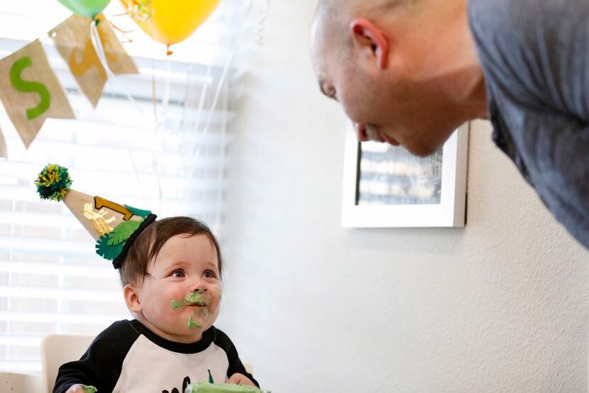 Hudson smiled at his father, Chris Marr, while having cake at the quads’ first birthday...