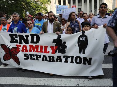 Hundreds of immigrant rights advocates and others demonstrated at the Federal Building in...