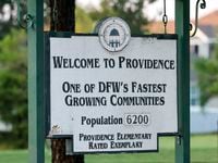 A sign welcomes people to Providence Village, Texas, Tuesday, June 21, 2022.