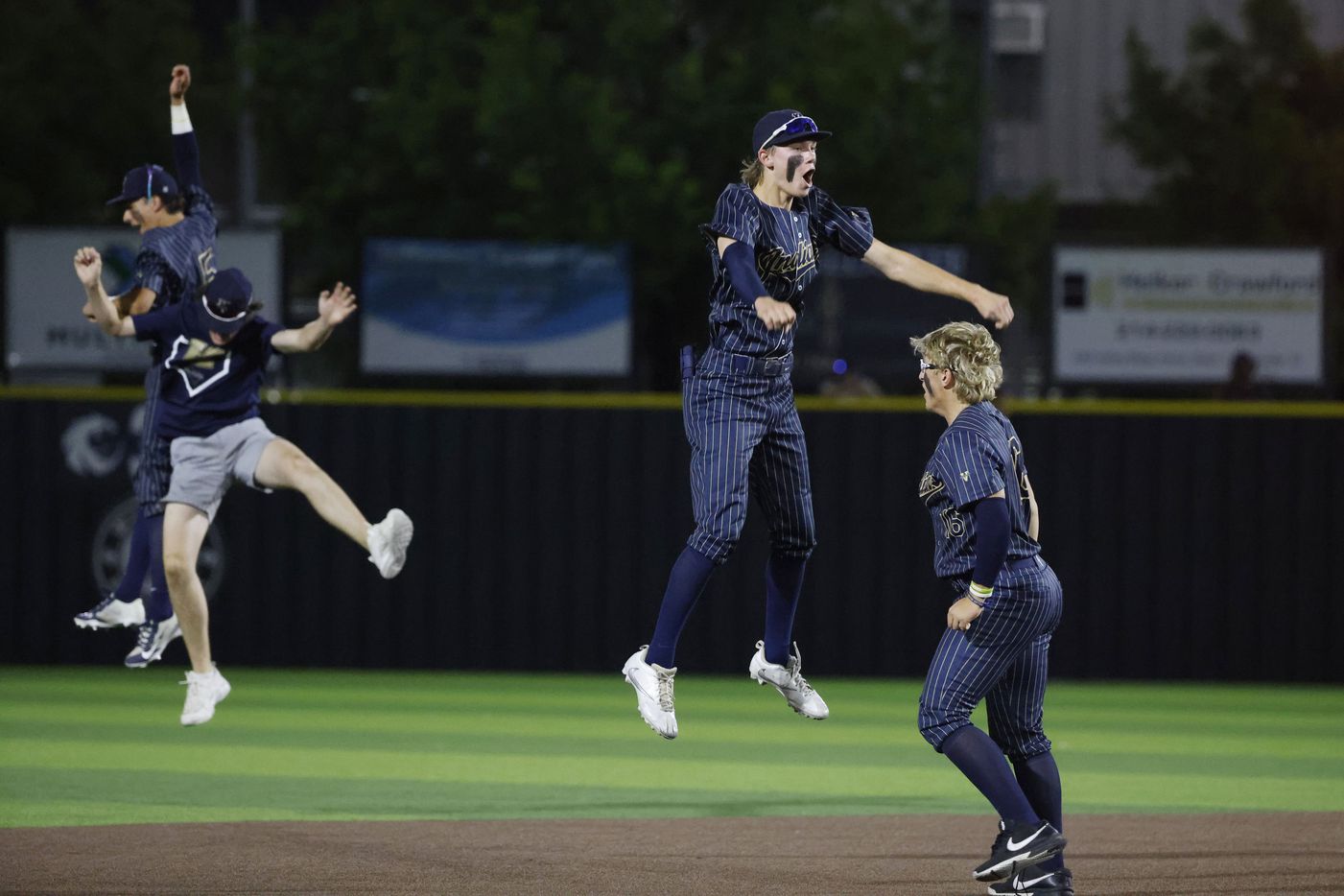 Keller's Brayden Simmons, center, and his teammates celebrate as they defeated Flower Mound...