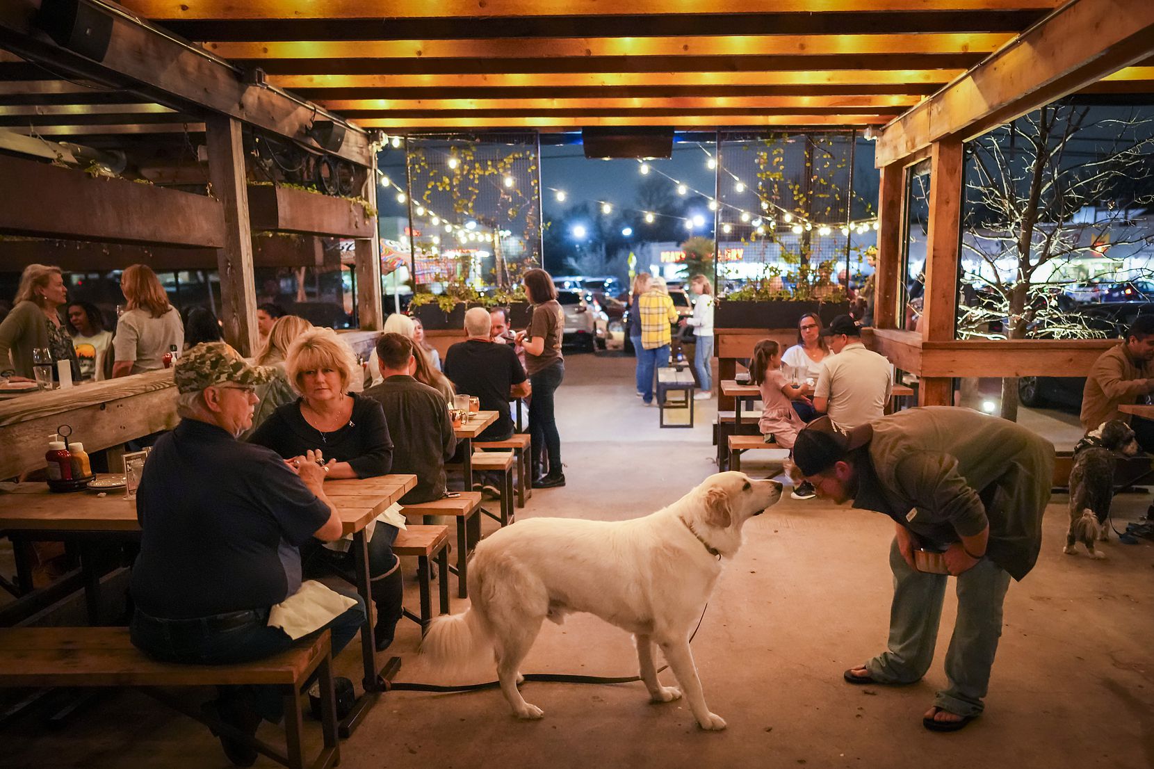 Byron and Tina Studdard relax on the dog-friendly patio at Goodfriend Beer Garden as their...