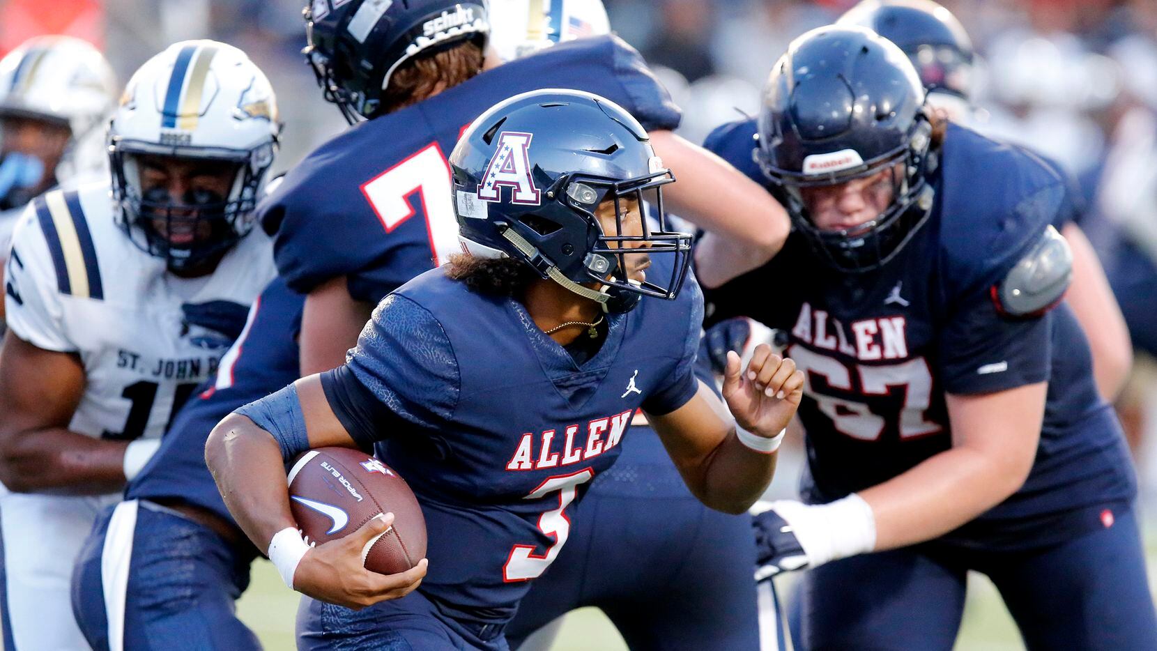 Allen quarterback Michael Hawkins (3) looks for room to run during a season-opening 52-14...