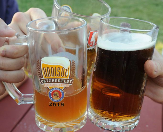 Friends prost to Oktoberfest in Addison Circle Park in Addison. 