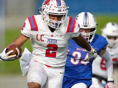 Parish Episcopal running back Andrew Paul (2) sprints away from the pursuit of Midland...
