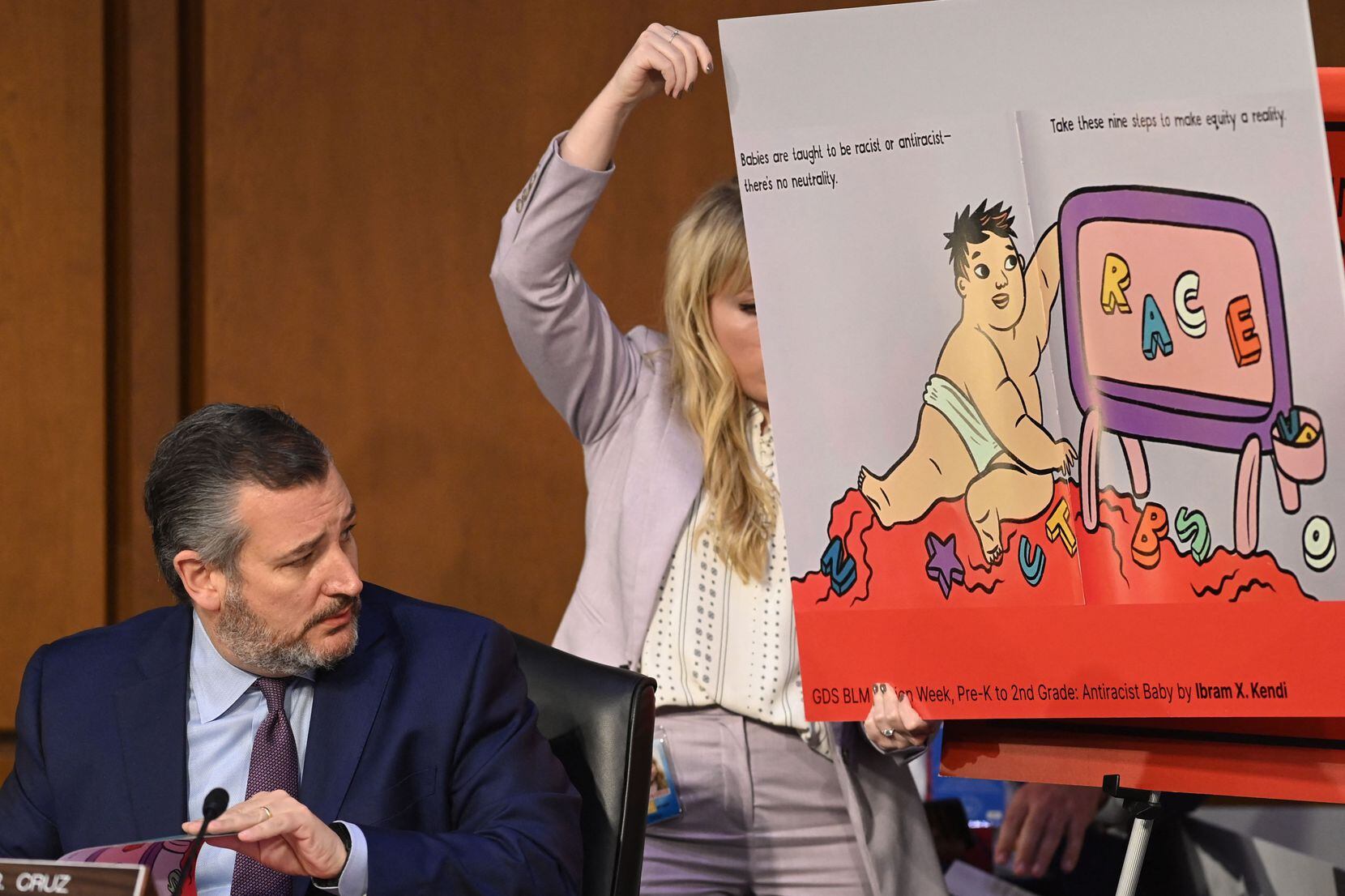 Sen. Ted Cruz looked to a display of a children's book on race while speaking during the...