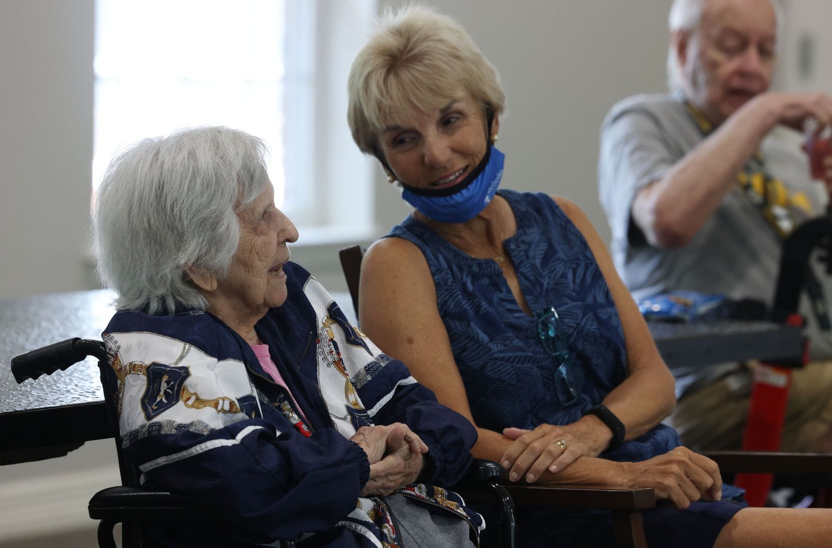 Bonnie Whitlow, 95, and her daughter Terry Kay share a moment as Eric Kolb, a founder of the ...