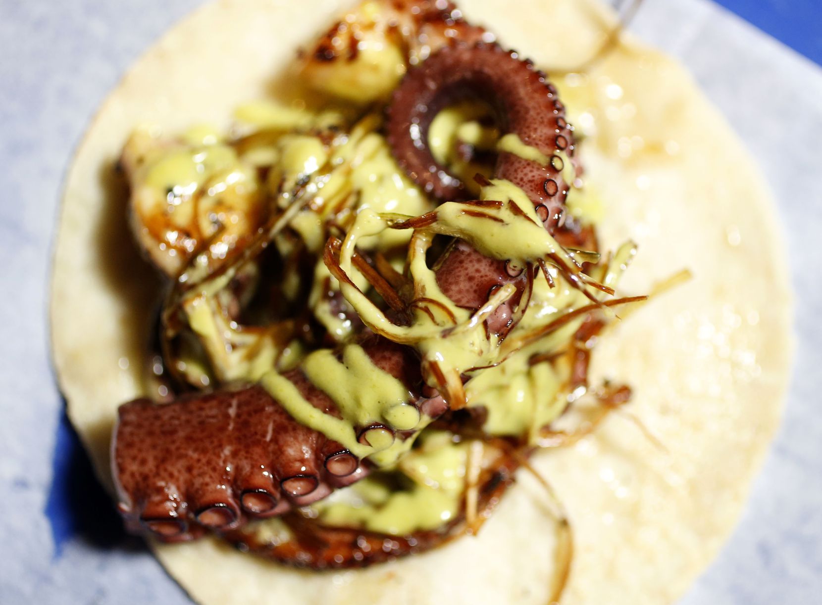 One of the popular dishes at Revolver Taco Lounge in Deep Ellum is the pulpo (octopus) taco....