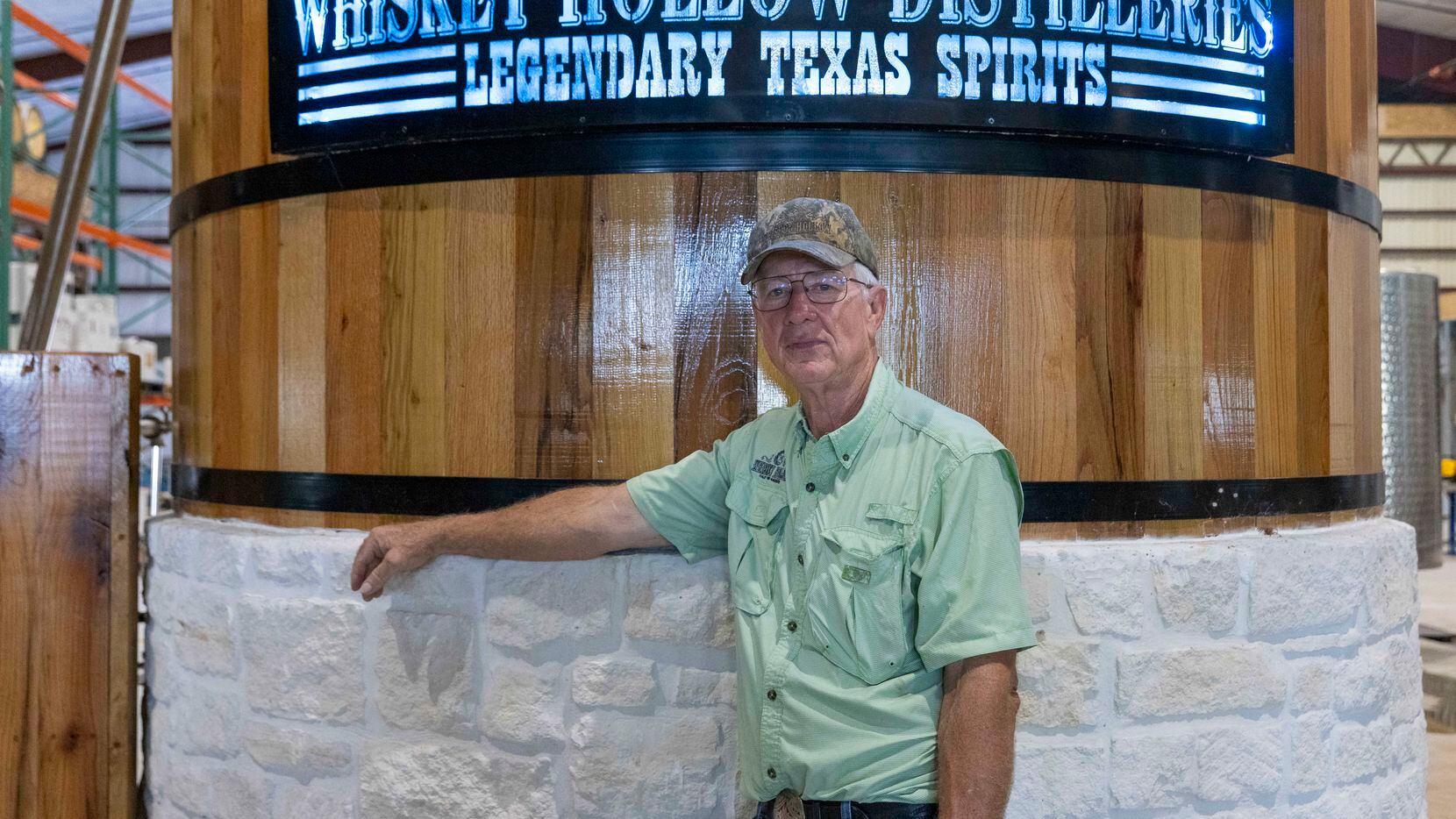 Master distiller and founder Les Beasley stands in front of the 38-foot copper still he...