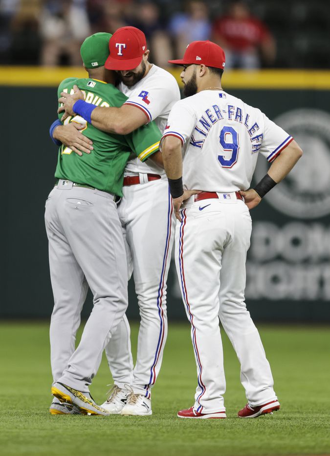 Oakland Athletics shortstop Elvis Andrus, left, greets former teammates Texas Rangers’ Joey...