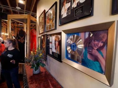 Gold records line the wall of country music legend Reba McEntire’s new restaurant, Reba’s...
