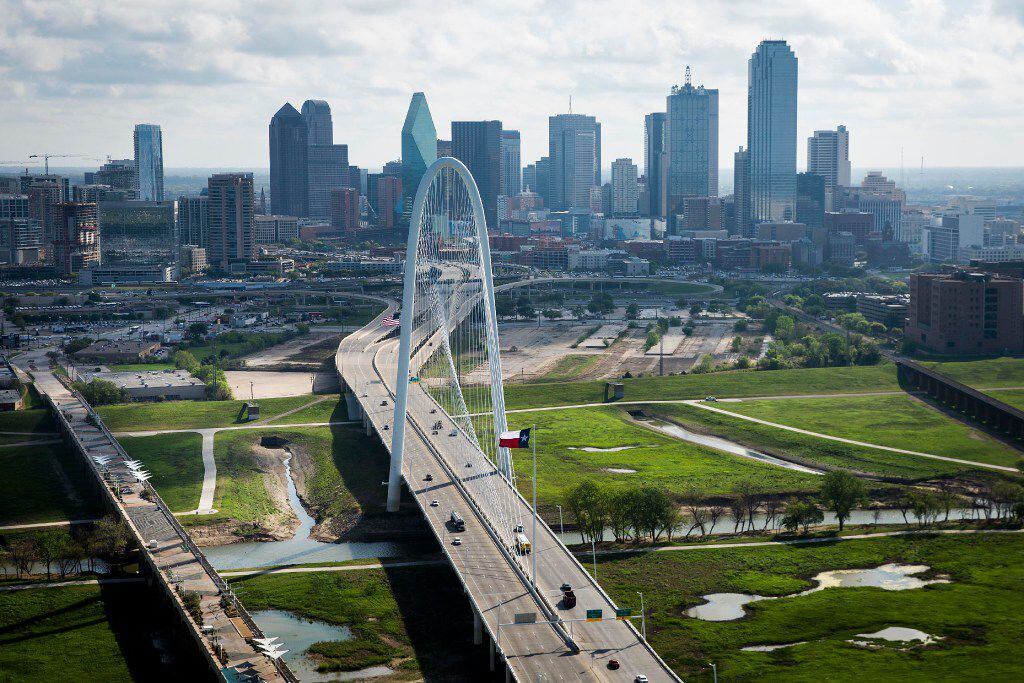 The Margaret Hunt Hill Bridge bridge and downtown Dallas skyline