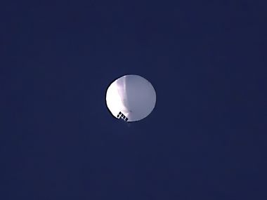 A high altitude balloon floats over Billings, Mont., on Wednesday, Feb. 1, 2023. The huge,...