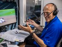 Texas Rangers broadcaster Eric Nadel laughs with fellow broadcaster Matt Hicks while...