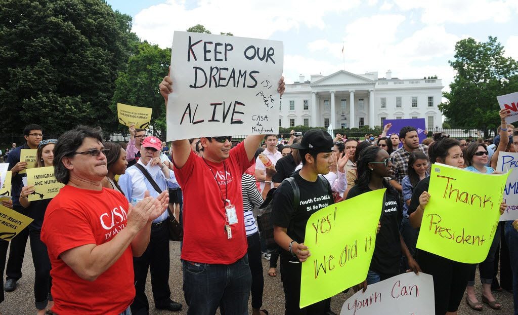 At the White House on June 15, 2012, demonstrators celebrate President Barack Obama's announcement that his administration will grant children brought to the U.S. without legal documents the opportunity to legally work in the country. 