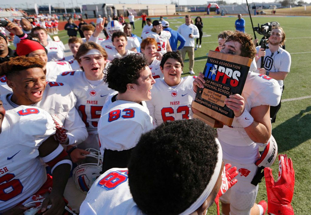 Parish Episcopal's Preston Stone (2) kisses the trophy after receiving it during the awards presentation after defeating Plano John Paul II 42-14 in the TAPPS Division I State Championship game at Waco Midway's Panther Stadium in Hewitt, Texas on Friday, December 6, 2019. (Vernon Bryant/The Dallas Morning News)