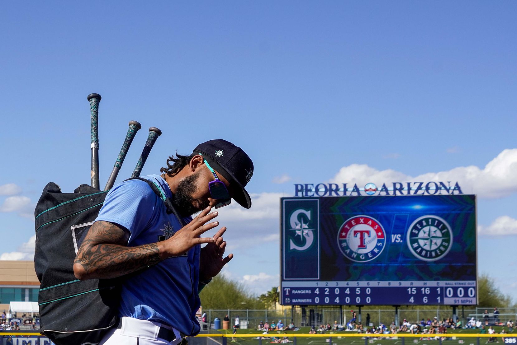 Seattle Mariners shortstop J.P. Crawford acknowledges cheers from fans as he leaves the field after the sixth inning of a spring training game against the Texas Rangers at Peoria Sports Complex on Wednesday, March 10, 2021, in Peoria, Ariz.