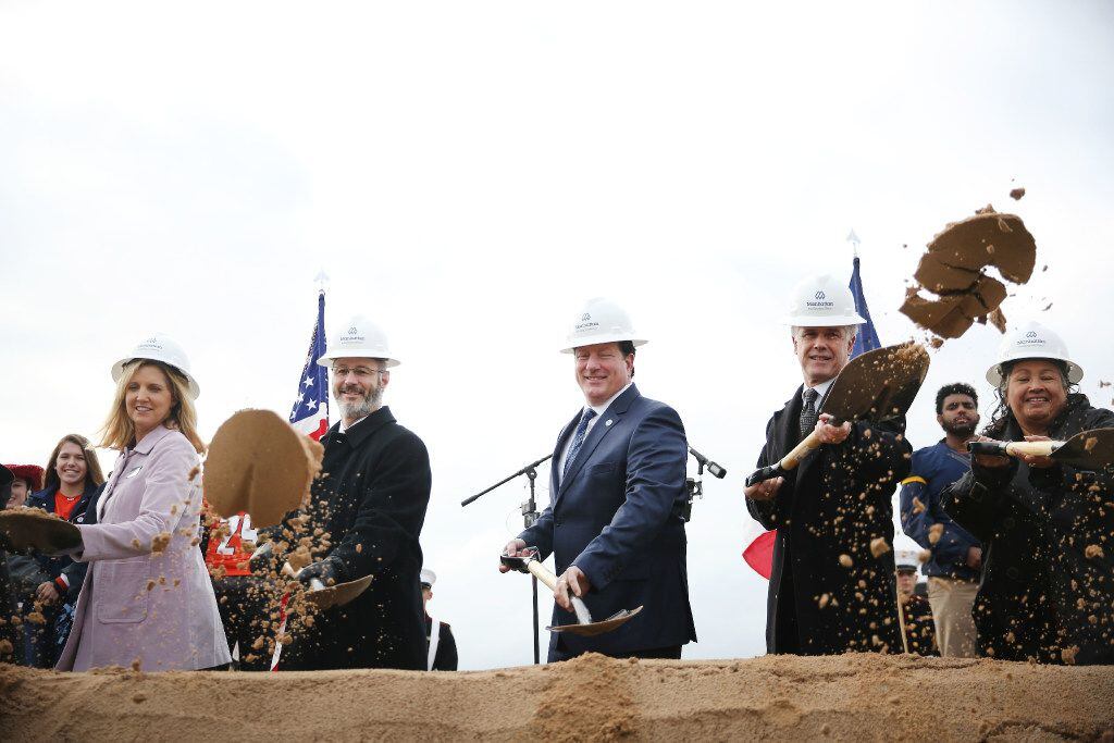 (From left) McKinney ISD trustee Amy Dankel, President Bobby Amick, Superintendent Rick McDaniel, McKinney Mayor Brian Loughmiller and trustee Maria McKinzie participate in the groundbreaking ceremony for McKinney ISD Stadium and Community Event Center on Tuesday.  (Andy Jacobsohn/The Dallas Morning News)