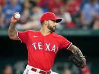 Texas Rangers relief pitcher Matt Bush delivers during the eighth inning against the Seattle...