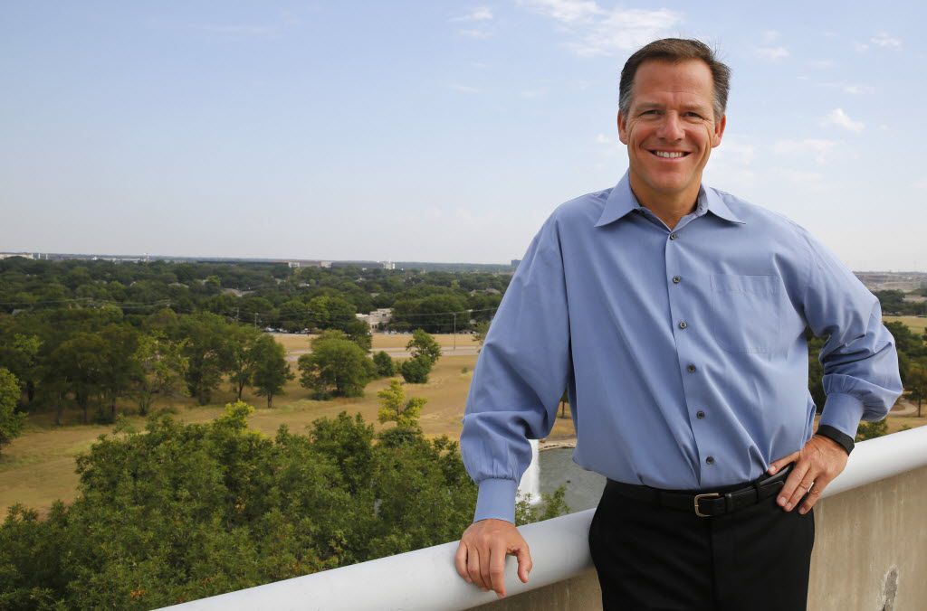 Mark Jordan poses on the parking garage at his company headquarters in Richardson in August...