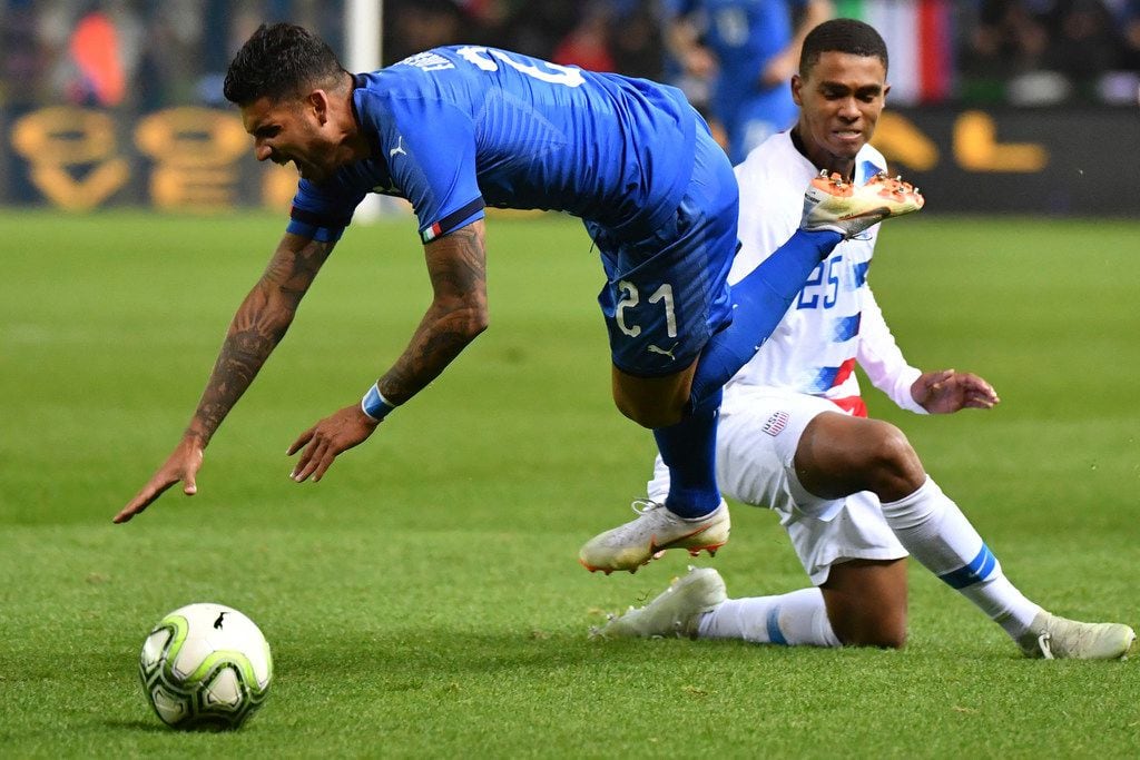 Unites States' Reggie Cannon, rear, fouls Italy's Emerson during the international friendly soccer match between Italy and the United States at Cristal Arena in Genk, Belgium, Tuesday, Nov. 20, 2018. (AP Photo/Geert Vanden Wijngaert)