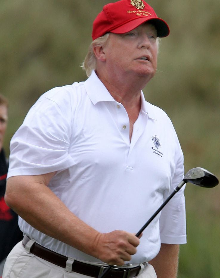 President Donald Trump plays golf at one of his resorts in this file image. Trump's net...
