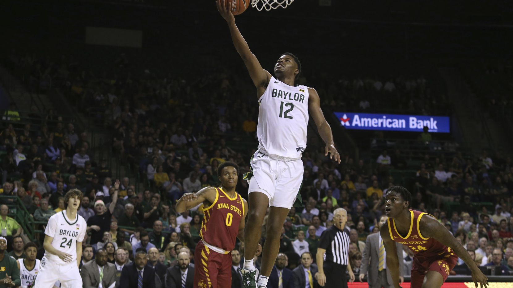 Baylor guard Jared Butler (12) scores between Iowa State forward Zion Griffin (0) and guard Terrence Lewis (24) during the second half of a game on Wednesday, Jan. 15, 2020, in Waco.