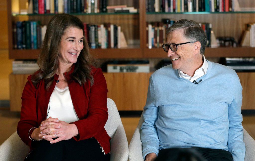Bill and Melinda Gates look toward each other and smile while being interviewed in Kirkland,...