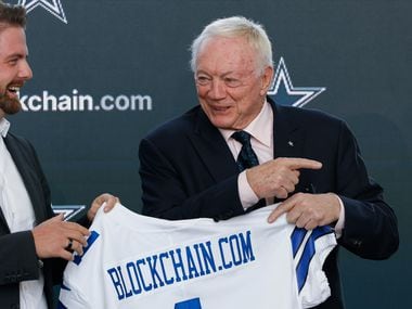 Blockchain.com co-founder and CEO Peter Smith, left, and Dallas Cowboys owner Jerry Jones...
