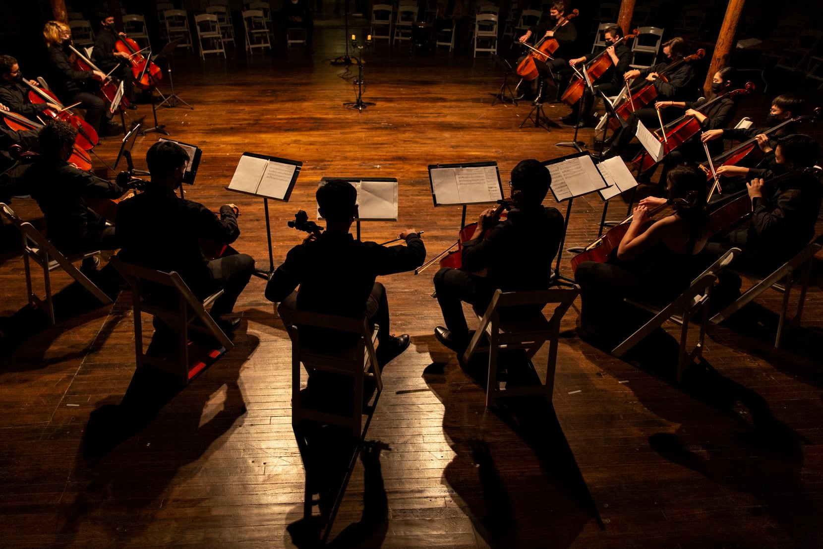Members of Texas Cellos perform a dress rehearsal at the McKinney Cotton Mill, where they...