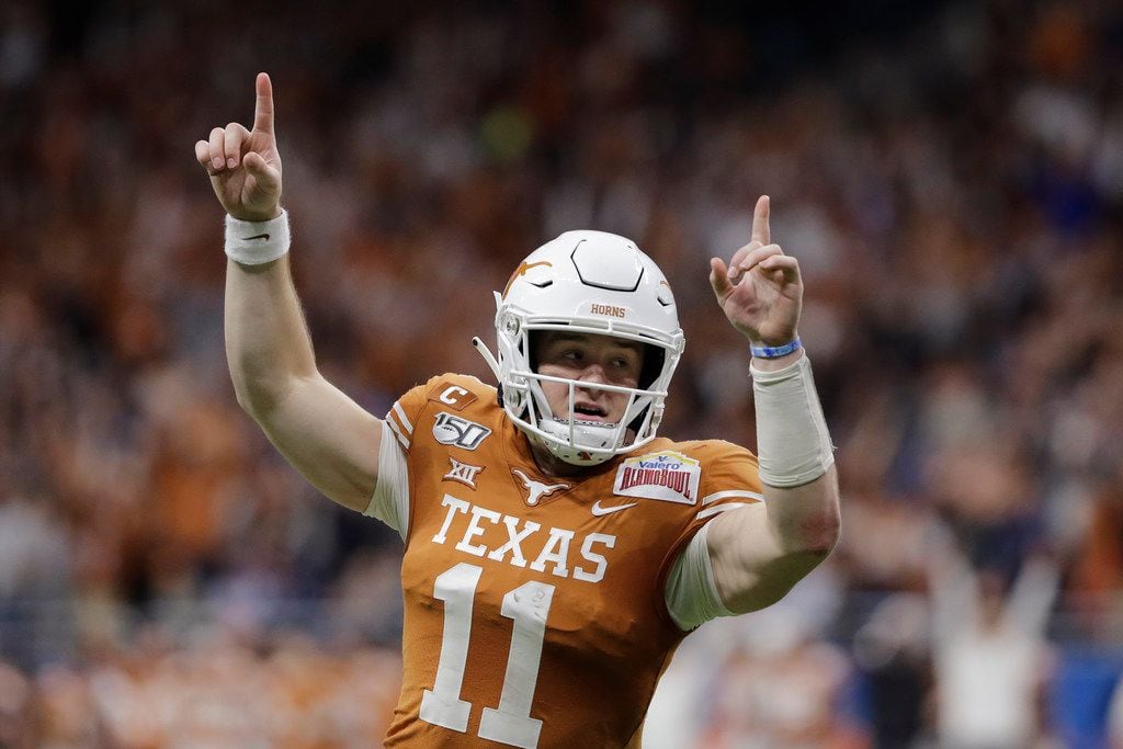 FILE - Texas quarterback Sam Ehlinger (11) celebrates a touchdown against Utah during the...