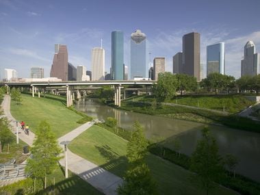 Downtown Houston skyline and Buffalo Bayou, which stretches 52 miles through Houston, from the mouth of the Houston Ship Channel to the forests of Memorial Park.