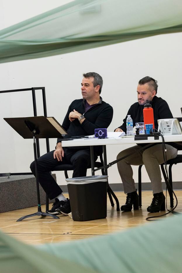 Director Tomer Zvulun (left) and assistant director Gregory Boyle watch as singers perform...